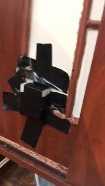 Bait station taped inside a wardrobe where termites were eating clothes and timber