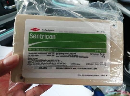A pack of genuine Sentricon termite bait held by a technician